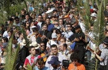 Christian pilgrims participate in the traditional Palm Sunday procession on Jerusalem's Mount of Olives. (photo credit: Miriam Alster/Flash90)