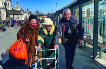 Shimon Sabag Helping Holocaust Survivor