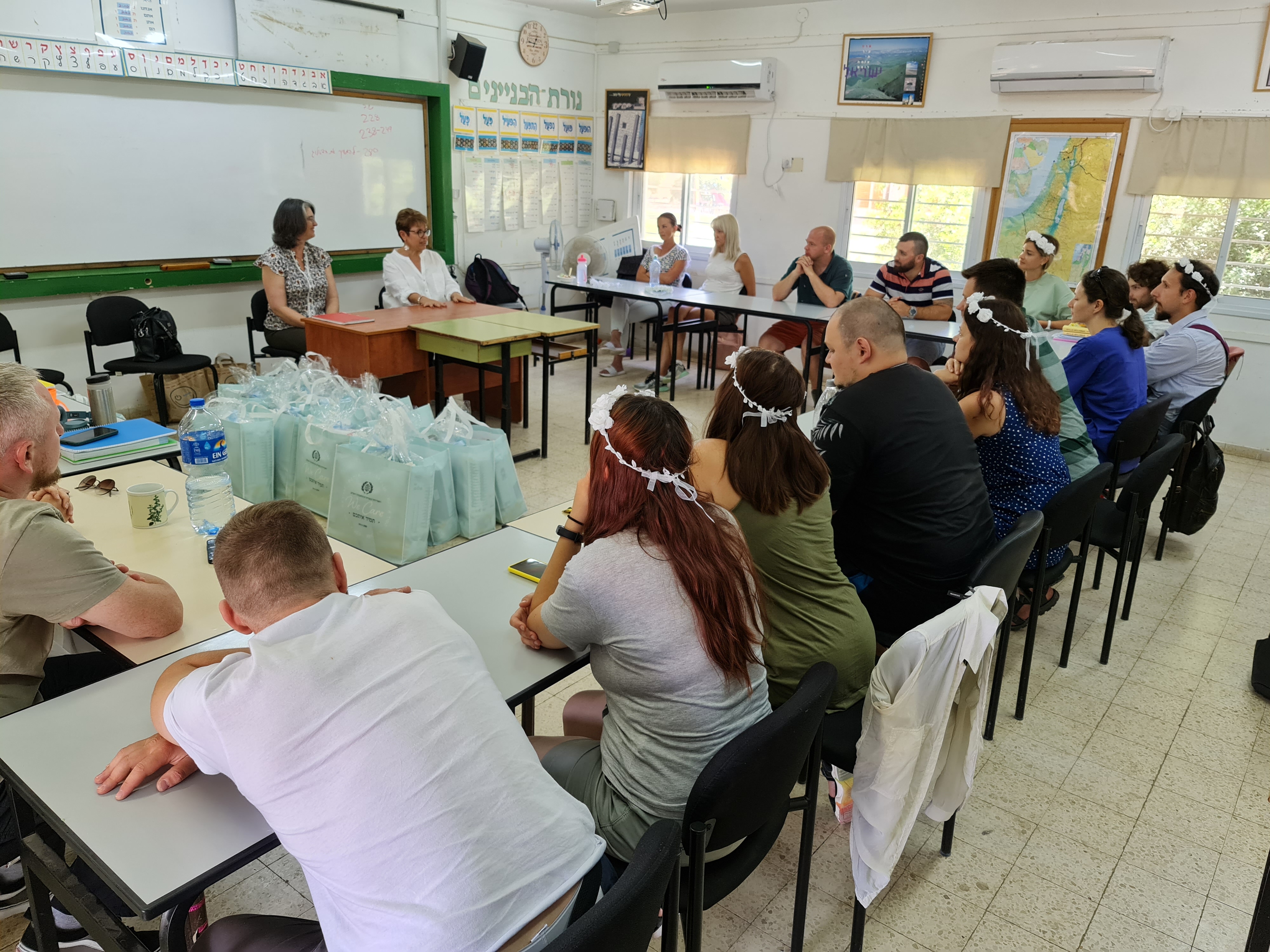 Nicole sits in classroom with students