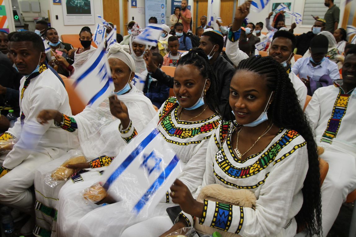 Ethiopian family in holding lounge of Ben Gurion awaiting their final papers to enter the land