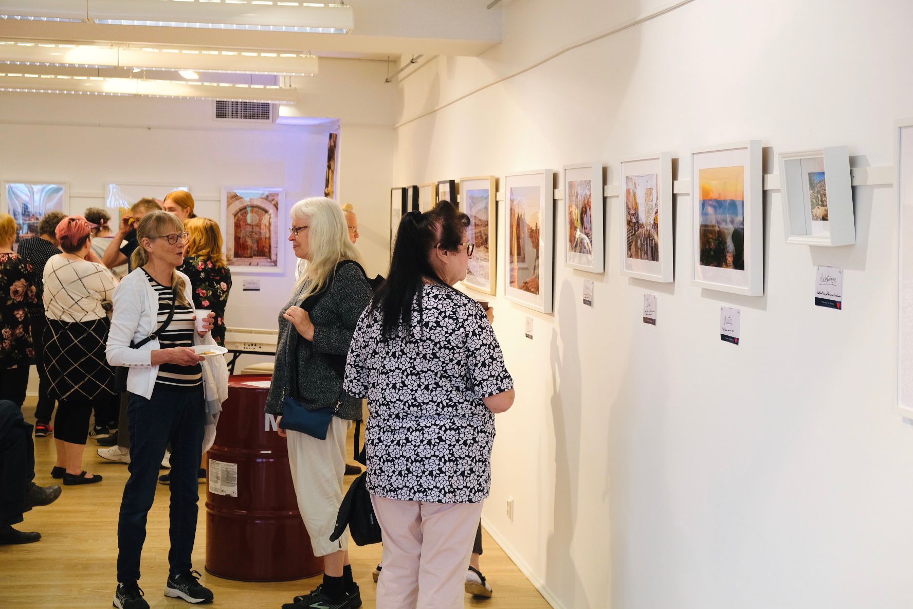 International-Finland-photo-exhibit. People view the photographs