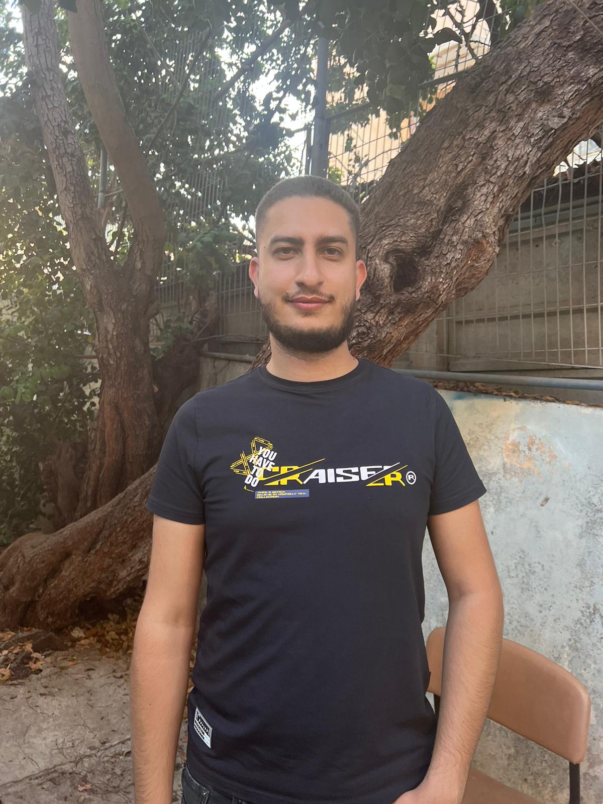 Basil, young Arab man on computer training course