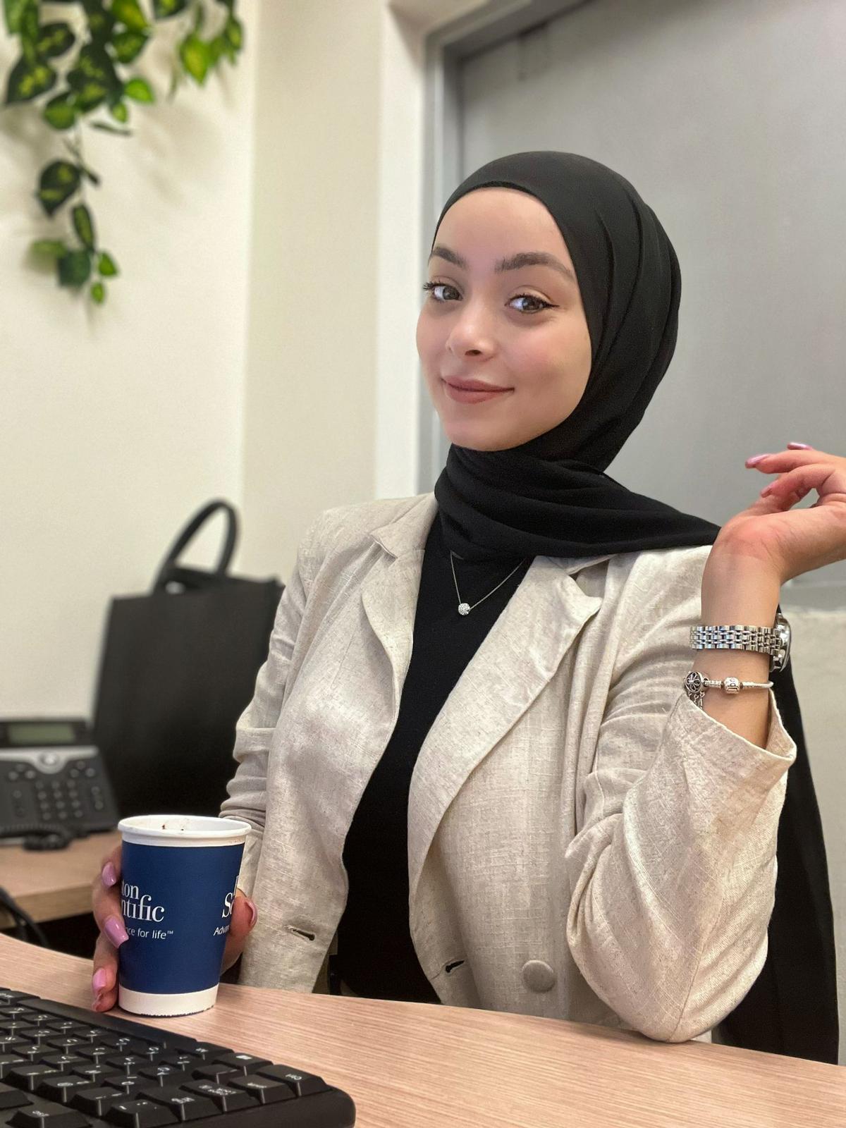 Heba, young Arab woman attends computer training course