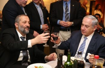 Netanyahu and Deri toasting in happier days