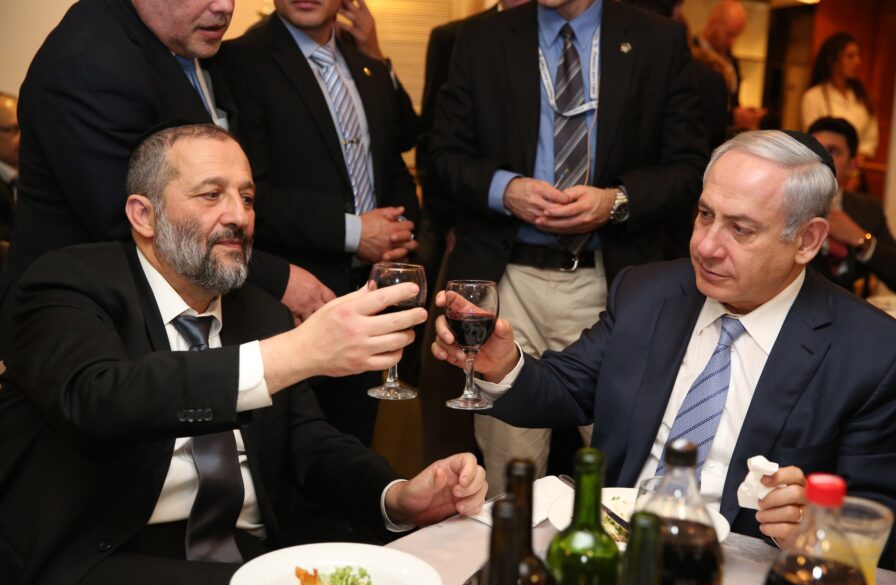 Netanyahu and Deri toasting in happier days