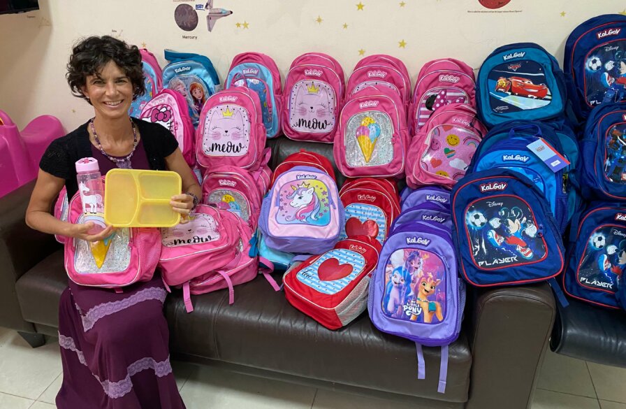 ICEJ AID Assistant with sponsored school bags