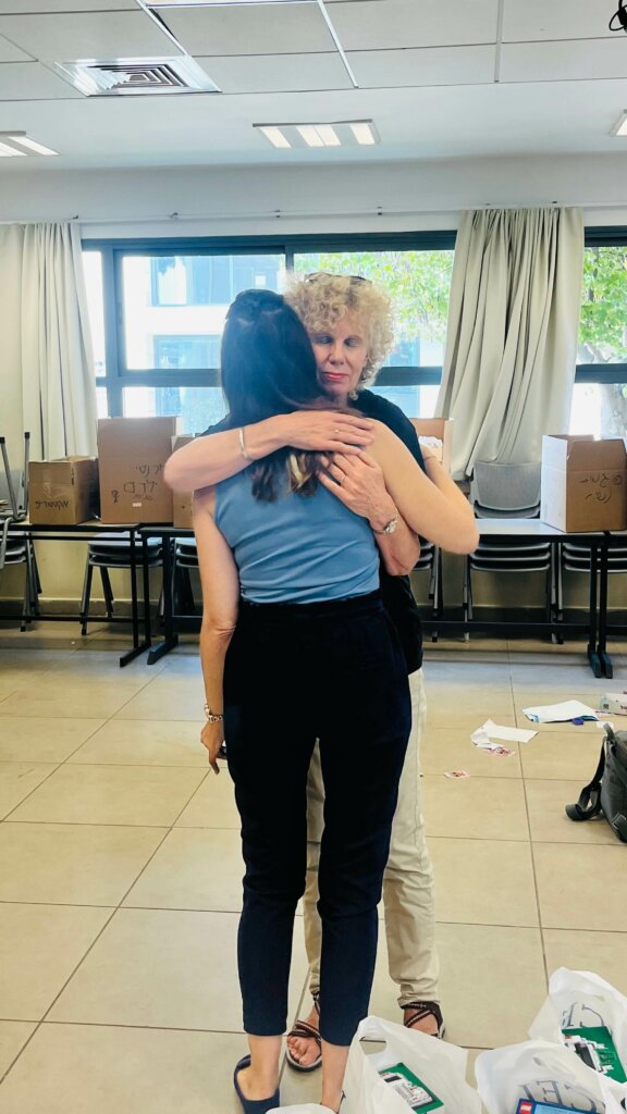Yudit Setz embraces Israeli helper
