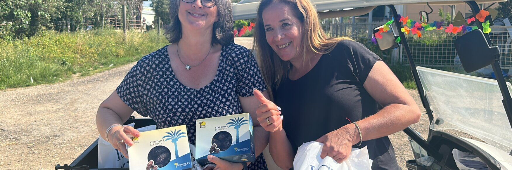 Nicole handing over gift packages