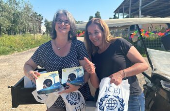 Nicole handing over gift packages