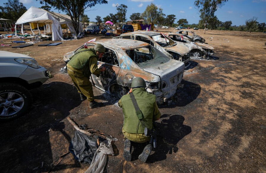 IDF troops inspect burned out cars at Nova music festival