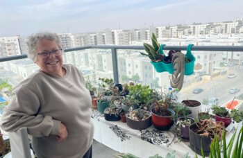 Bracha admires her plants