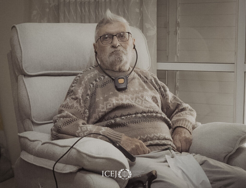 Holocaust survivor relaxes in his new recliner chair.