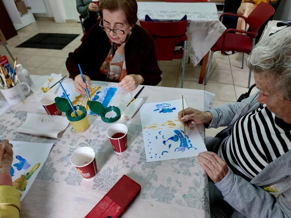 Haifa home residents enjoy painting in the Art therapy lcass