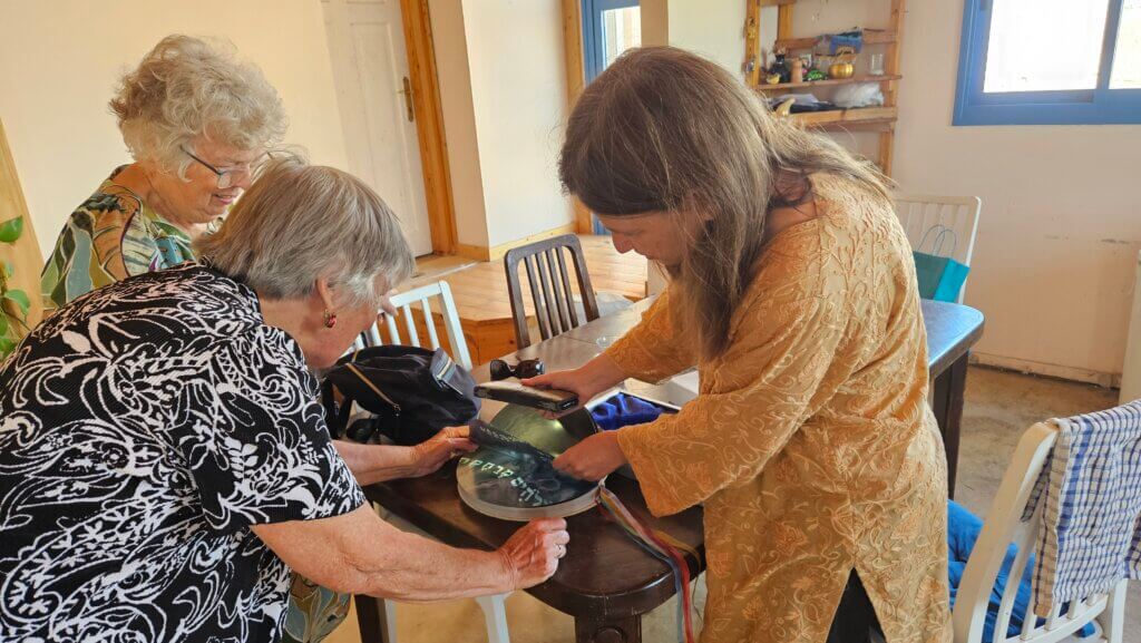The lady shows her artwork