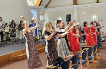 A dance team leads worship at the Warsaw conference