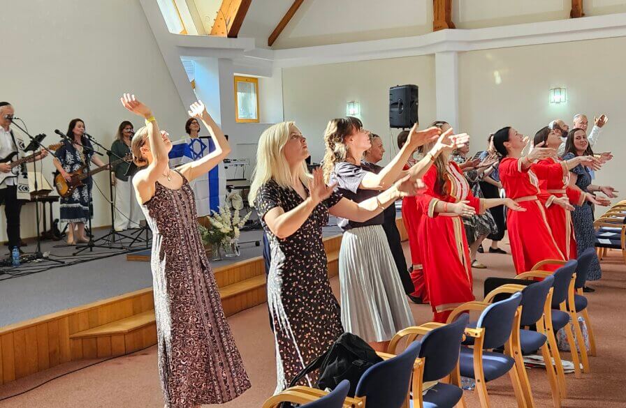 A dance team leads worship at the Warsaw conference
